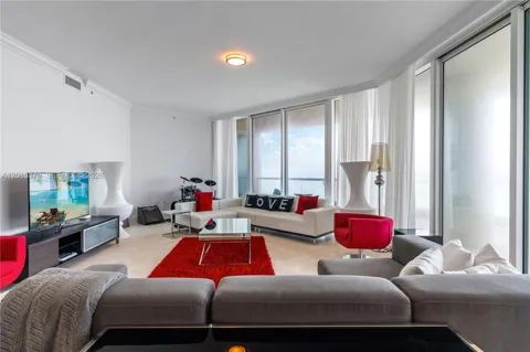 16047 Collins Ave #704