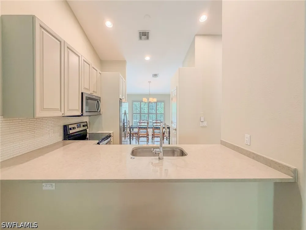 AVION WOODS COURT #104 Naples, FL 34104