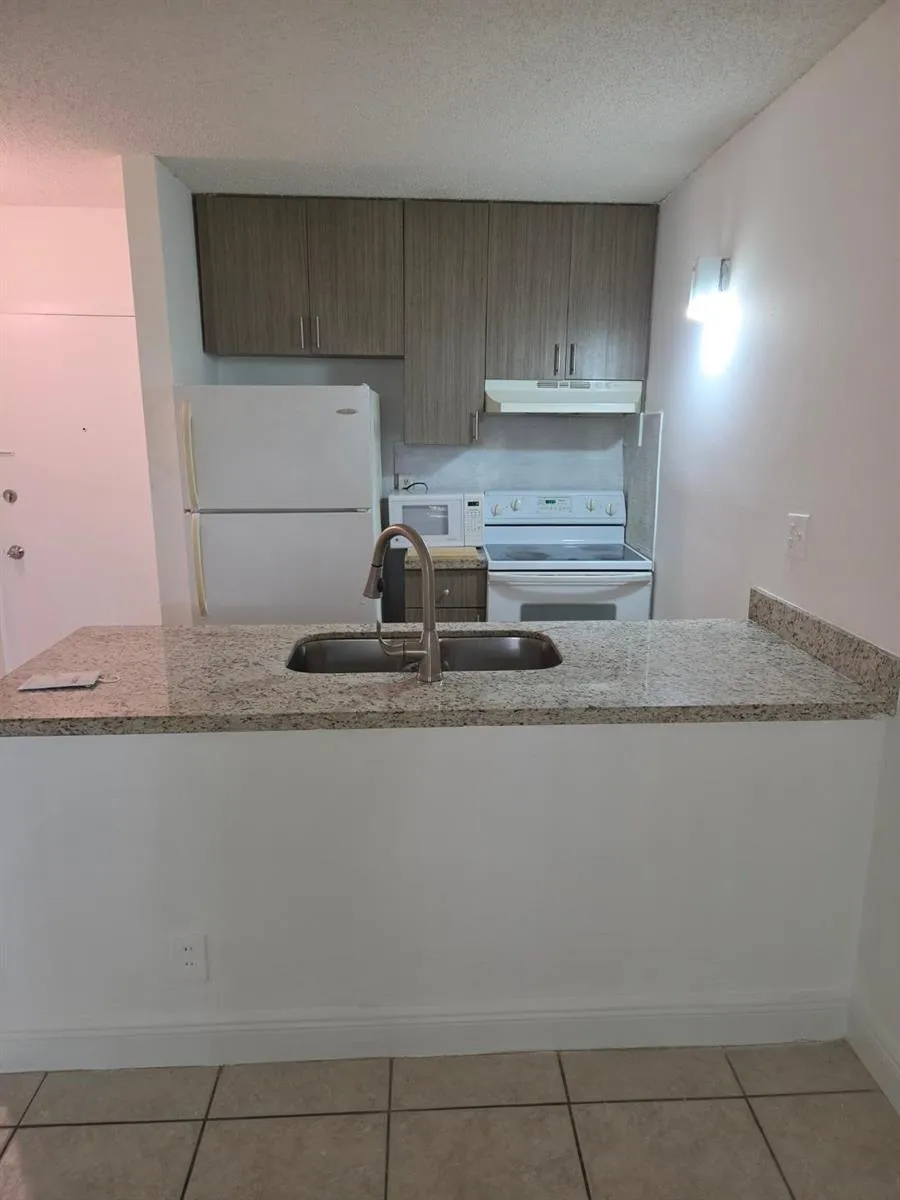 2401 RIVERSIDE DRIVE #306-B Coral Springs, FL 33065