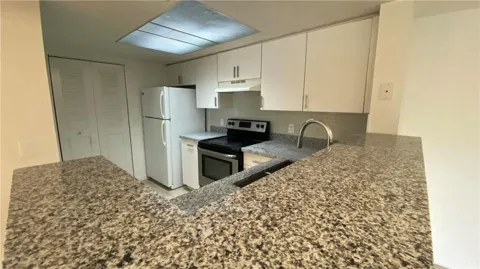 5045 WILES ROAD #205