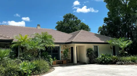 5125 WOODLAND LAKES DRIVE