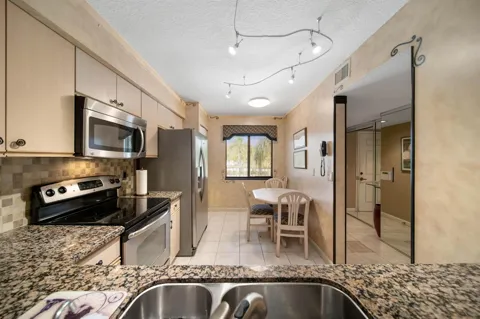 6037 POINTE REGAL CIRCLE #307