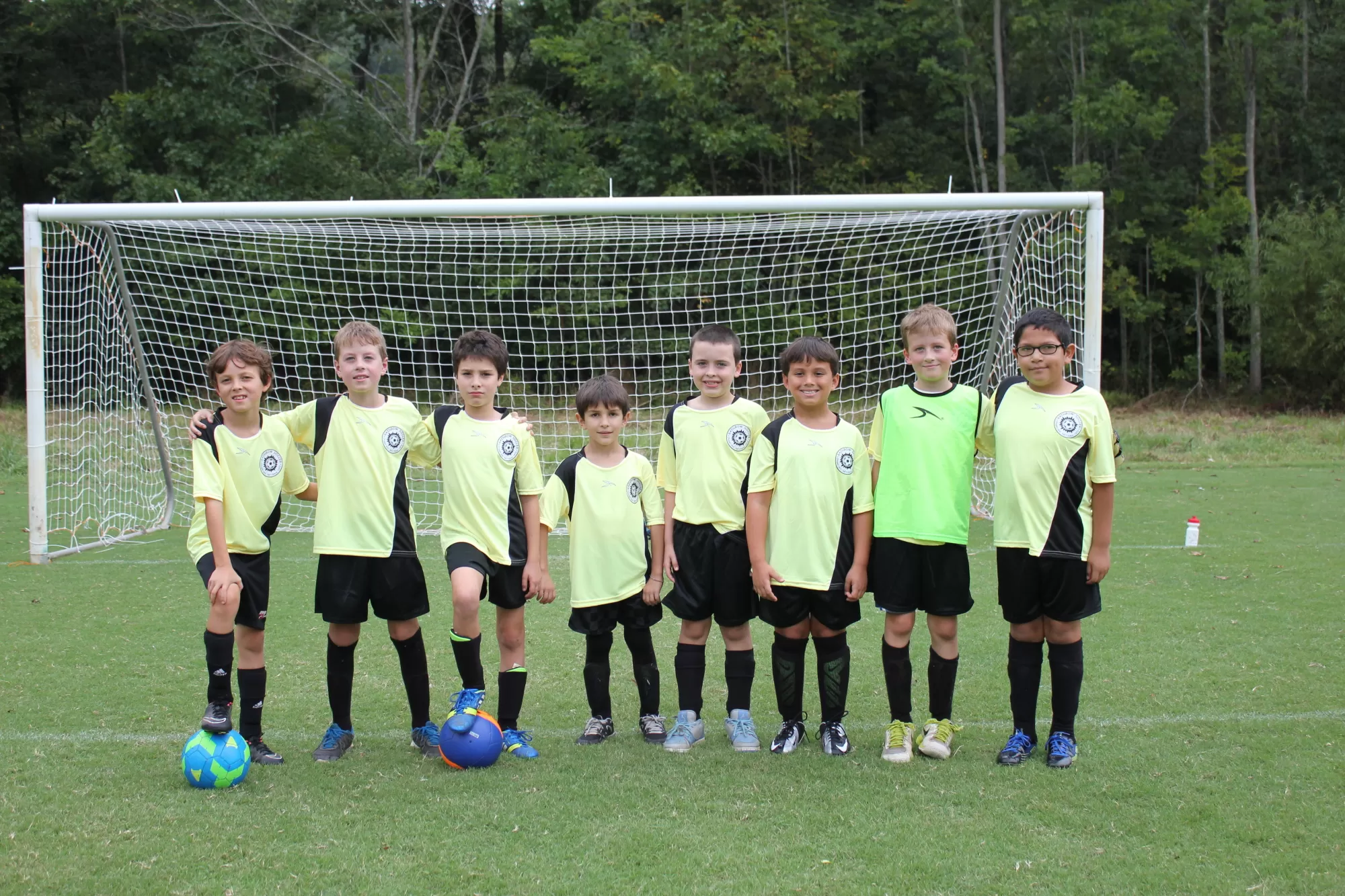Kids wearing green soccer uniforms
